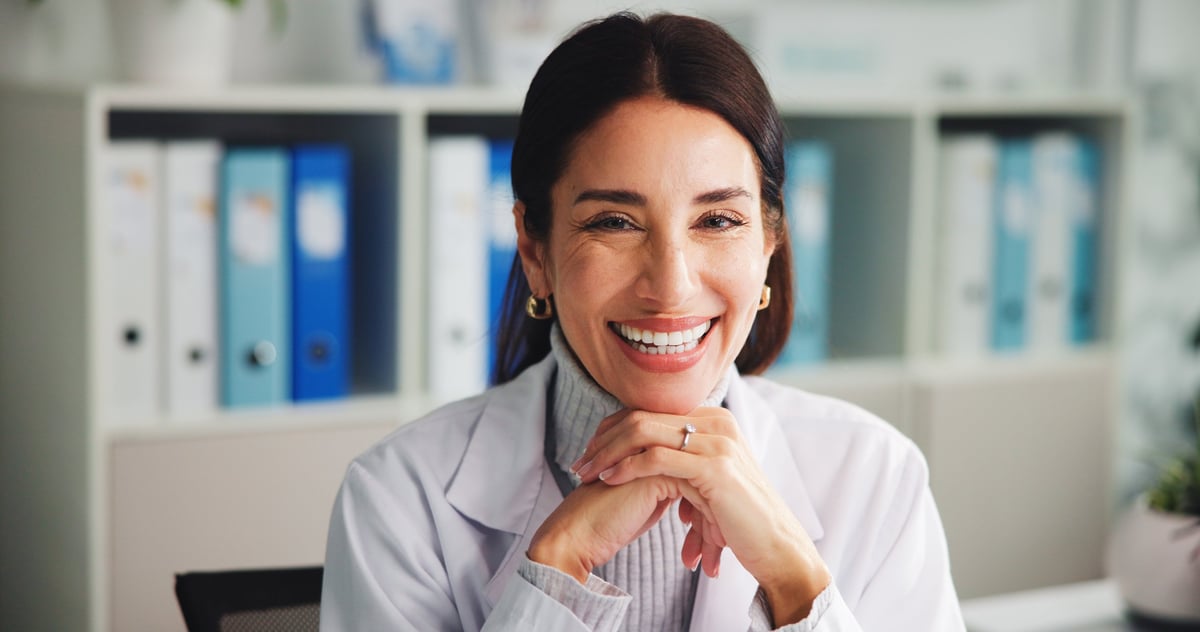 Portrait, doctor and woman with pride in office, hospital and smile for healthcare services or help. Confident, mature person and medical professional with happiness in clinic, specialist